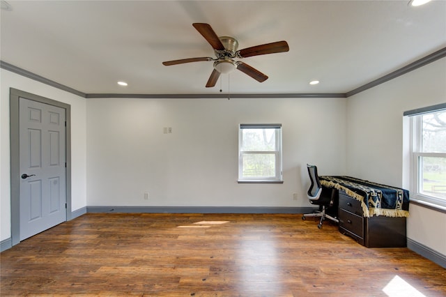 interior space featuring ornamental molding, recessed lighting, wood finished floors, and baseboards