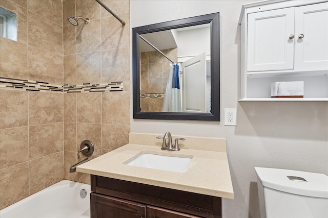 full bath with toilet, shower / bath combo with shower curtain, and vanity