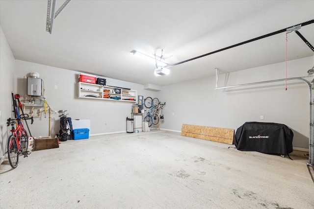 garage with a garage door opener and water heater