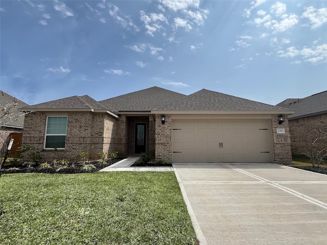 view of front of house featuring a garage, a shingled roof, concrete driveway, a front lawn, and brick siding