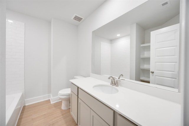 full bathroom featuring toilet, wood finished floors, visible vents, and baseboards