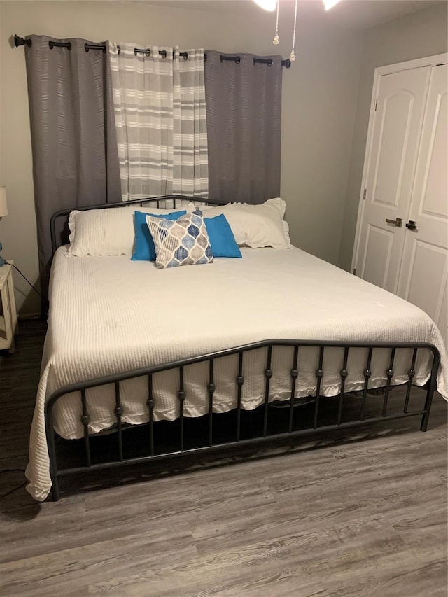 bedroom featuring wood finished floors