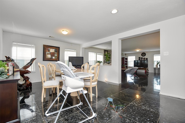 dining room featuring recessed lighting, visible vents, granite finish floor, and baseboards