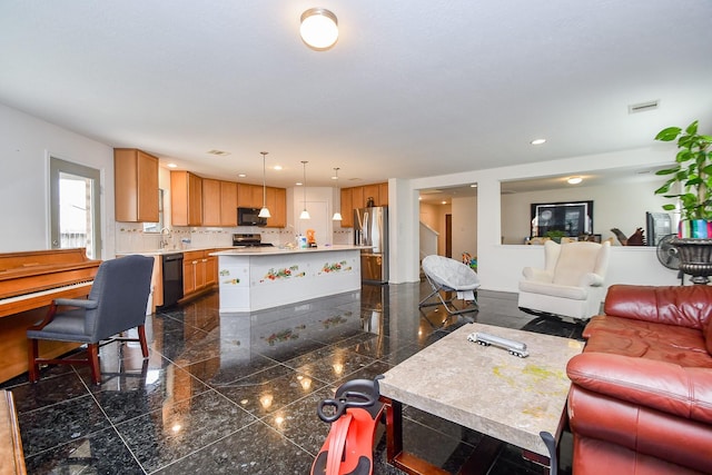 living area with granite finish floor, visible vents, and recessed lighting