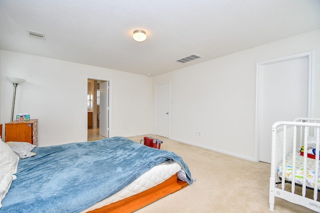 bedroom with baseboards, visible vents, and carpet flooring