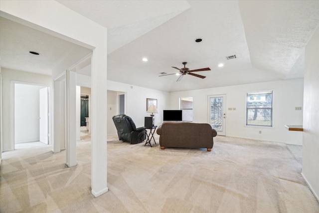 living room featuring a ceiling fan, recessed lighting, visible vents, and light colored carpet