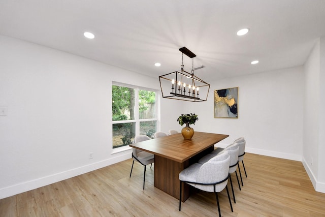 dining area with baseboards, recessed lighting, and light wood-style flooring