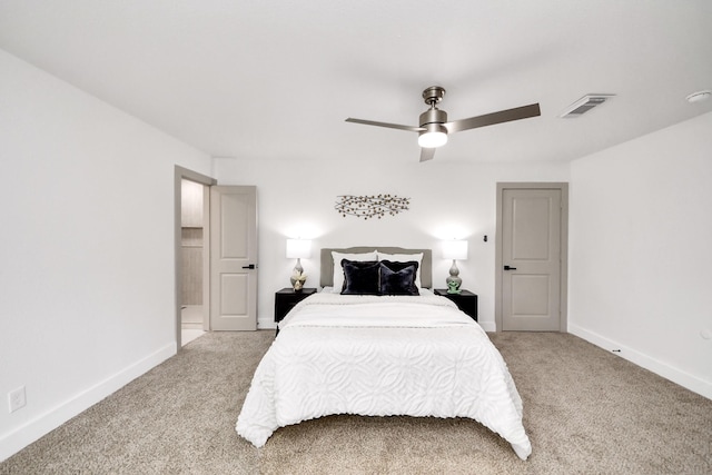 bedroom with light colored carpet, baseboards, visible vents, and ceiling fan