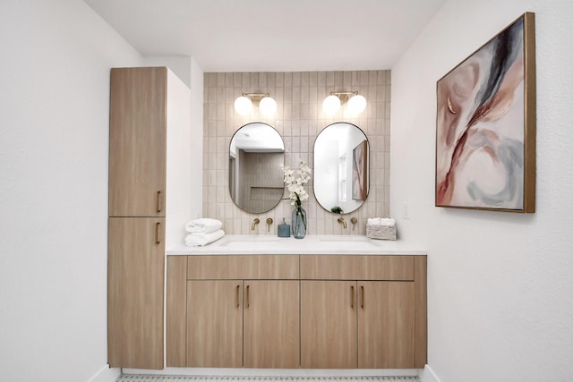 bathroom with baseboards and vanity