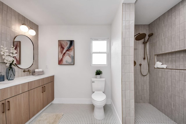 full bath with a walk in shower, baseboards, vanity, and toilet