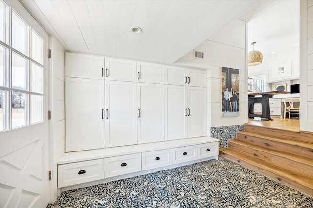 mudroom with wood ceiling and visible vents