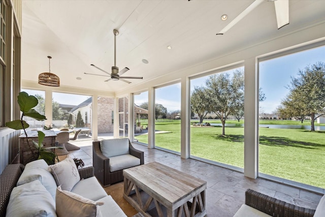 sunroom / solarium with a ceiling fan