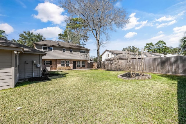 view of yard with a fenced backyard