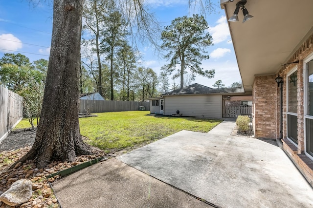 view of yard with a patio and a fenced backyard