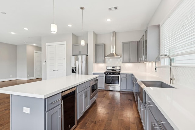 kitchen featuring stainless steel appliances, wine cooler, and gray cabinetry