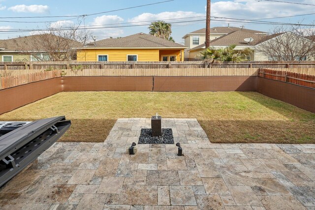 view of yard featuring a fenced backyard and a patio