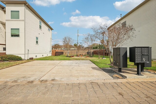 exterior space featuring mail area and fence