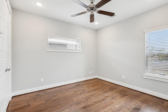 empty room featuring ceiling fan, baseboards, wood finished floors, and recessed lighting