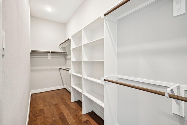 walk in closet featuring wood finished floors