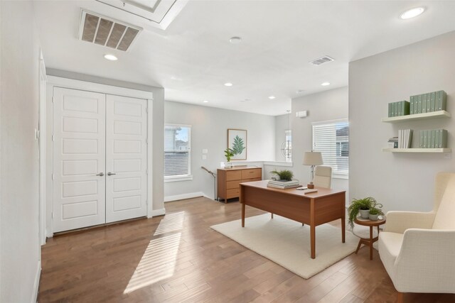 home office featuring baseboards, visible vents, wood finished floors, and recessed lighting