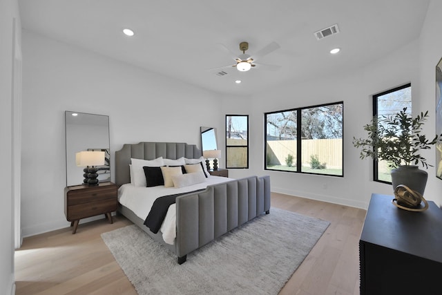 bedroom featuring visible vents, recessed lighting, light wood finished floors, baseboards, and ceiling fan