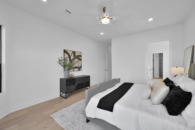 bedroom featuring visible vents, recessed lighting, light wood-type flooring, and baseboards