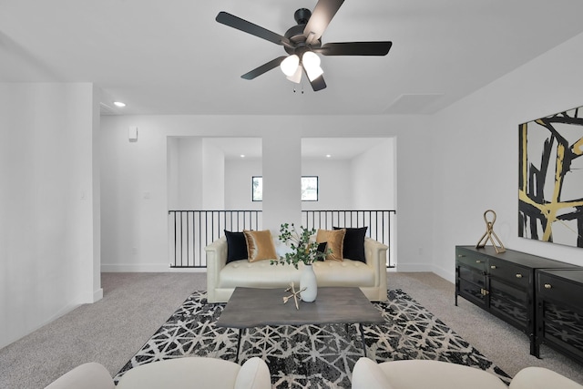 living area featuring recessed lighting, carpet, and baseboards