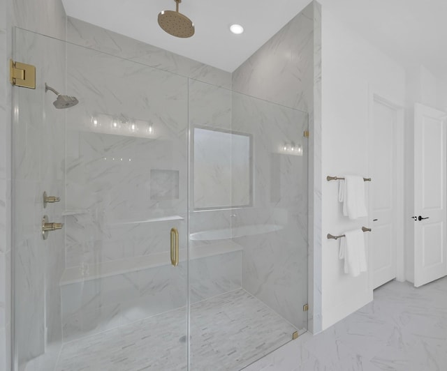 bathroom with marble finish floor and a marble finish shower