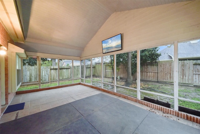 unfurnished sunroom with vaulted ceiling