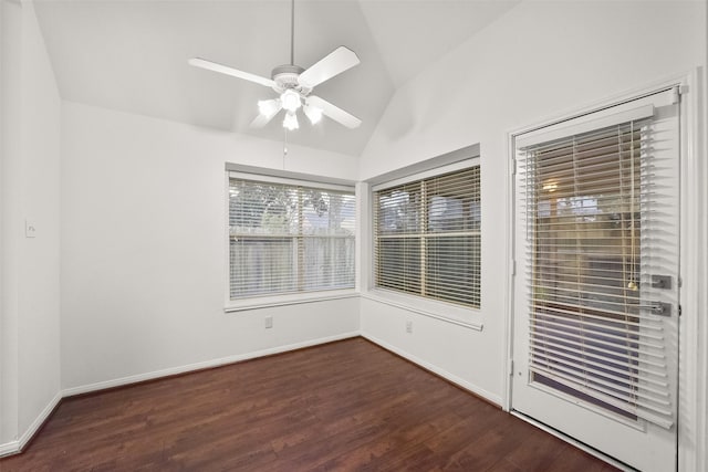 unfurnished room with lofted ceiling, wood finished floors, a ceiling fan, and baseboards