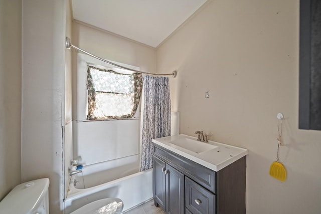 bathroom with vanity, shower / bath combination with curtain, and toilet