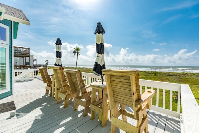 wooden deck with a water view