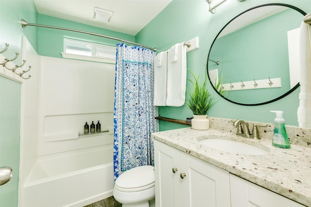 full bath with toilet, shower / bath combo with shower curtain, and vanity