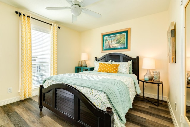 bedroom featuring a ceiling fan, baseboards, and wood finished floors