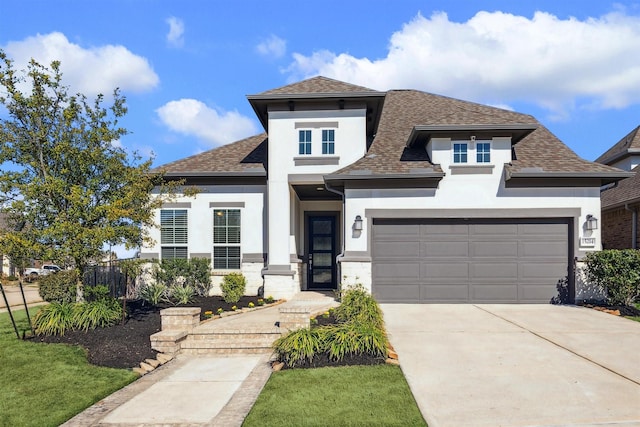 view of front of home with a garage, driveway, a shingled roof, and stucco siding