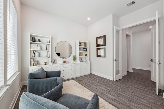 sitting room with recessed lighting, visible vents, dark wood finished floors, and baseboards