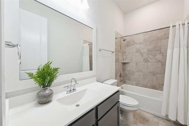 full bath with vanity, toilet, and shower / bath combo with shower curtain