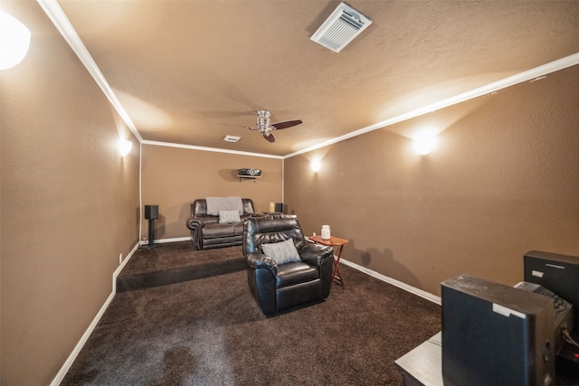 home theater with ornamental molding, carpet, visible vents, and baseboards