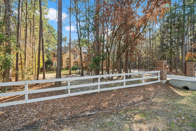 view of yard featuring a fenced front yard and a gate