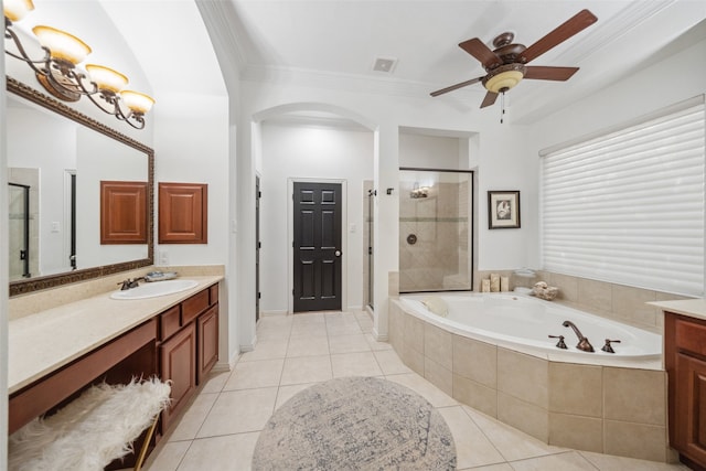 full bath featuring a garden tub, tile patterned flooring, vanity, and a stall shower