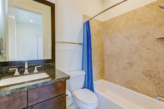 full bathroom featuring shower / bathtub combination with curtain, toilet, and vanity