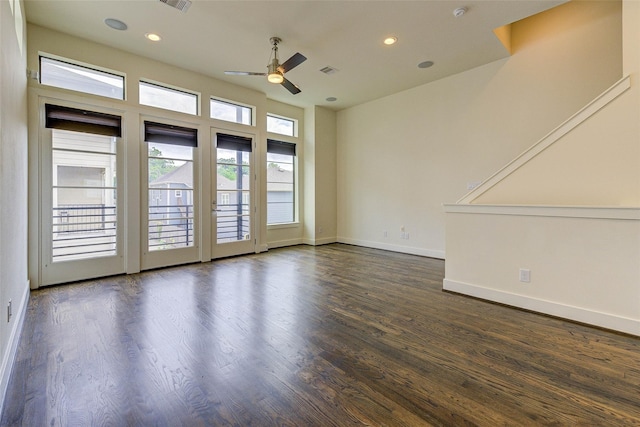 empty room with ceiling fan, recessed lighting, visible vents, baseboards, and dark wood finished floors