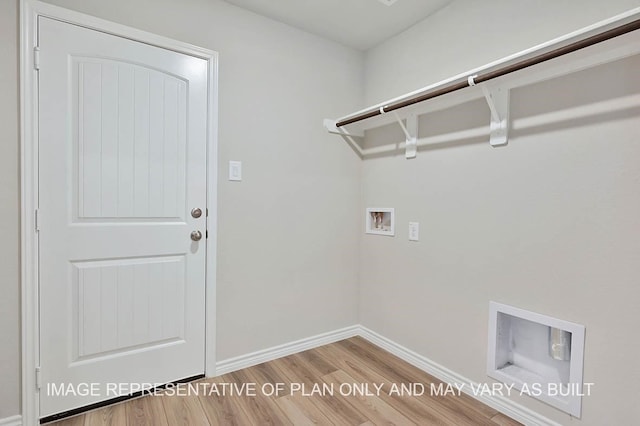 laundry room featuring laundry area, hookup for a washing machine, baseboards, and wood finished floors