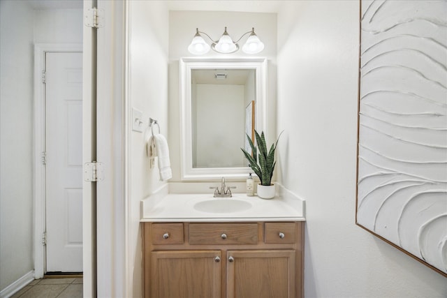 bathroom featuring tile patterned flooring and vanity