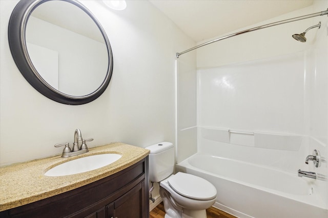 full bathroom featuring wood finished floors, shower / bath combination, vanity, and toilet