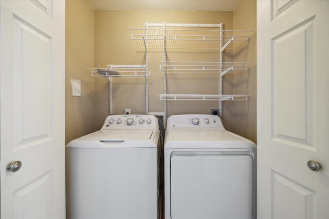 clothes washing area featuring laundry area and independent washer and dryer