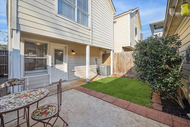 view of patio / terrace with central AC and fence