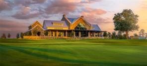 9975 Monarch Landing Cv, Willis, TX 77318 - surrounding community with golf course view