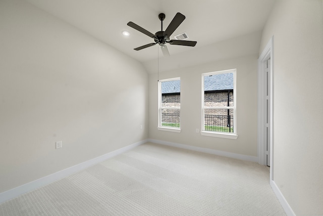 9975 Monarch Landing Cv, Willis, TX 77318 - unfurnished room featuring light carpet, baseboards, ceiling fan, and recessed lighting