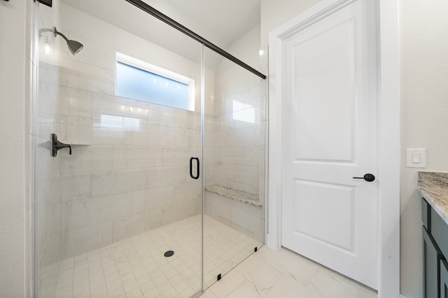 9975 Monarch Landing Cv, Willis, TX 77318 - bathroom featuring a shower stall, vanity, and marble finish flooring